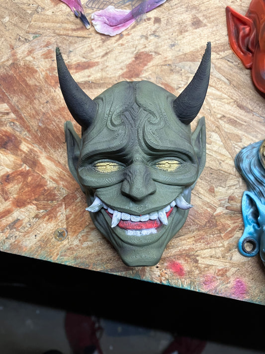 Green oni with gold eyes